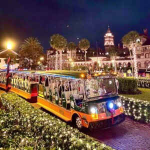 Guests riding a trolly at the St. Augustine Night of Lights Festival